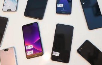 Various smartphones displaying price tags in Bangladesh currency